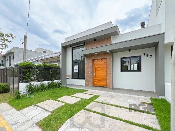 Casa em Porto Alegre, no bairro Hípica, com 3 dormitório(s), e 3 banheiros, à venda. — foto 3