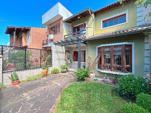 Casa em Porto Alegre, no bairro Hípica, com 3 dormitório(s), e 2 banheiros, à venda. — foto 2