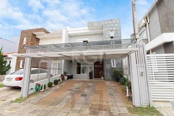 Casa em Porto Alegre, no bairro Hípica, com 3 dormitório(s), e 3 banheiros, à venda. — foto 2
