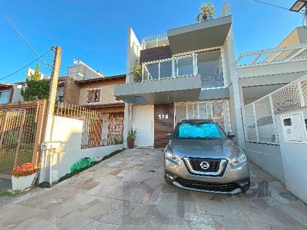 Casa em Porto Alegre, no bairro Hípica, com 3 dormitório(s), e 3 banheiros, à venda. — foto 2