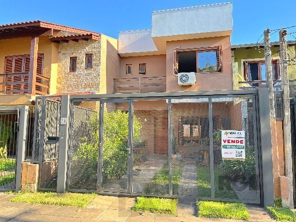 Casa em Porto Alegre, no bairro Hípica, com 3 dormitório(s), e 3 banheiros, à venda. — foto 2