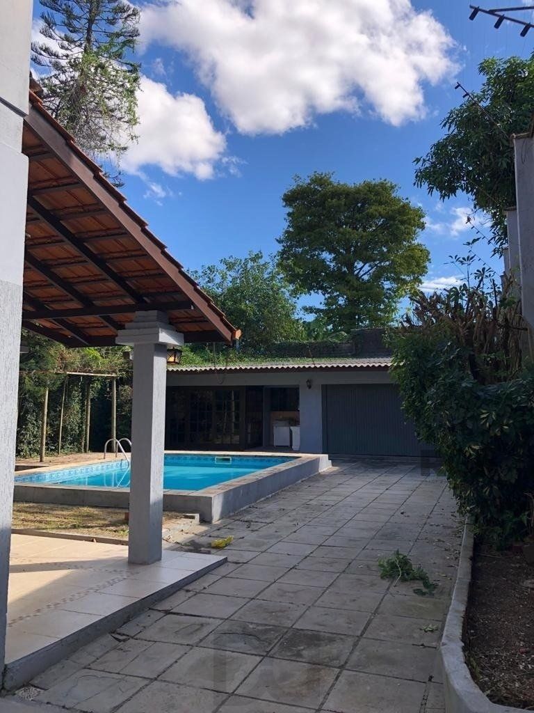 Casa de 365m² - 4 dormitórios sendo 3 suítes e 5 vagas de garagem no bairro Partenon — foto 3