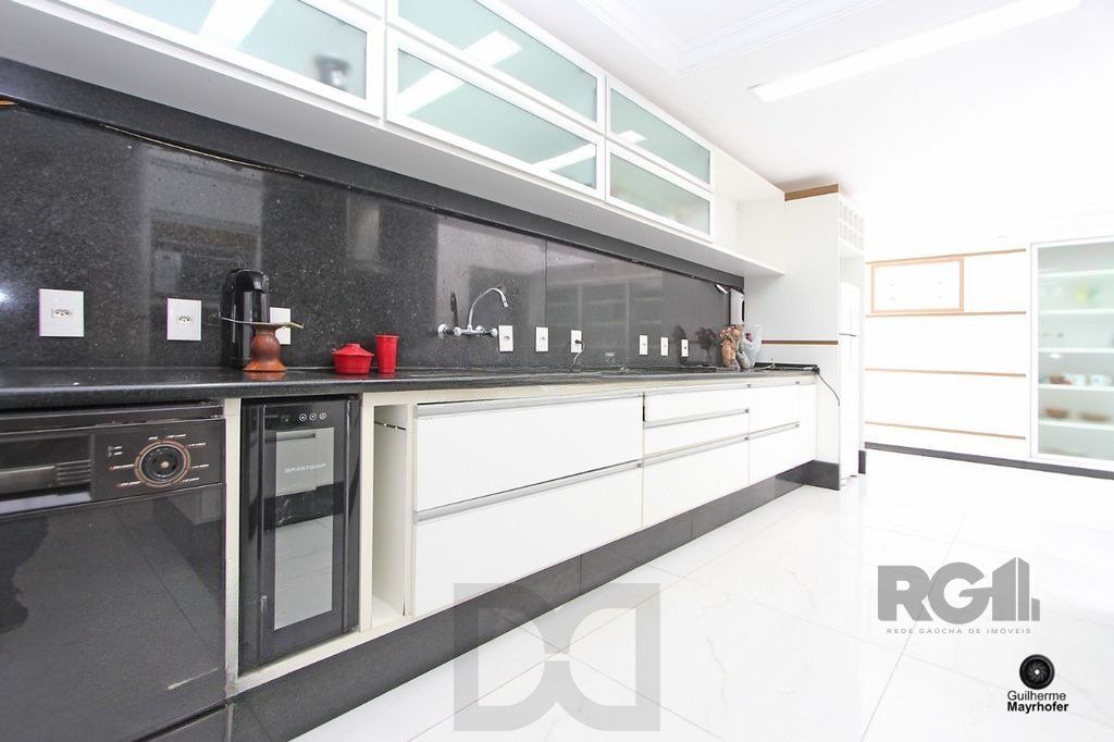 Casa com 5 suítes, 7 banheiros, 4 vagas no bairro Partenon — foto 41