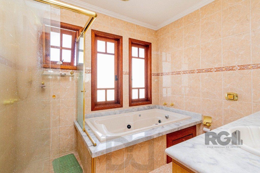 Casa de 4 dormitórios 304m² no bairro Jardim Lindóia — foto 32
