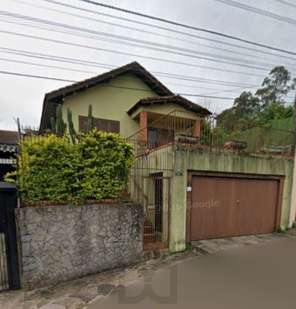 Casa com 2 dormitórios e edícula nos fundos no Bairro Nonoai — foto 1