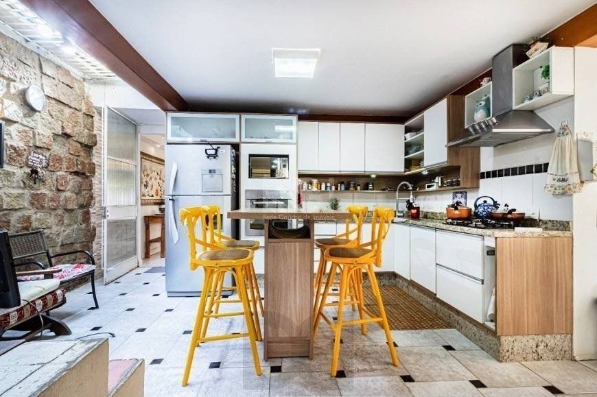 Excelente casa de 264m² com 4 dormitórios no bairro Menino Deus — foto 9