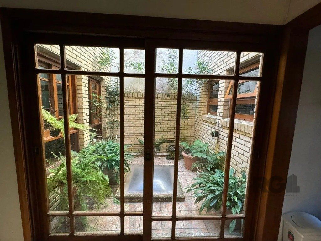 Casa com 4 dormitórios no bairro nonoai — foto 22