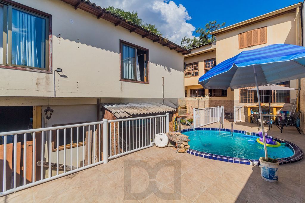Casa 4 dormitórios à venda no Bairro Nonoai - Porto Alegre — foto 1
