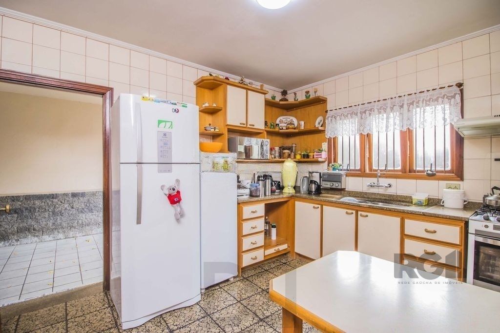 Casa de 329m² - 4 dormitórios, 1 suíte, 6 vagas no bairro Vila Jardim — foto 22