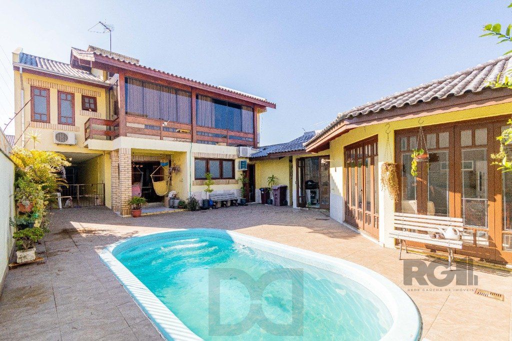 Casa de 4 dormitórios 304m² no bairro Jardim Lindóia — foto 1