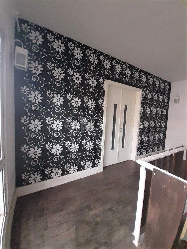 Casa com 233m², 2 dormitórios sendo 1 suíte, living com lareira, espaço gourmet com churrasqueira, pátio e 2 vagas de garagem no bairro Sarandi — foto 12