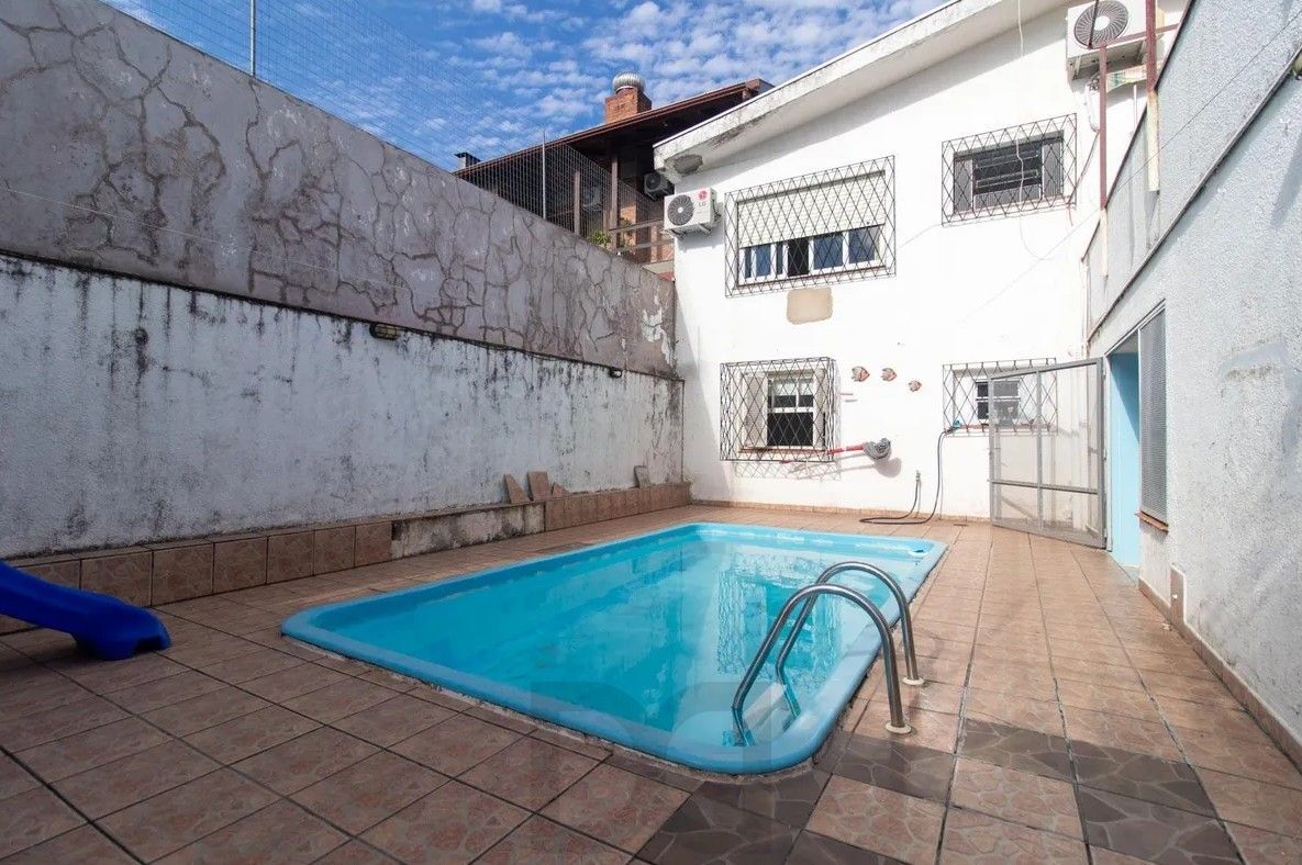 Casa com 4 dormitórios e energia solar no bairro Nonoai. — foto 33