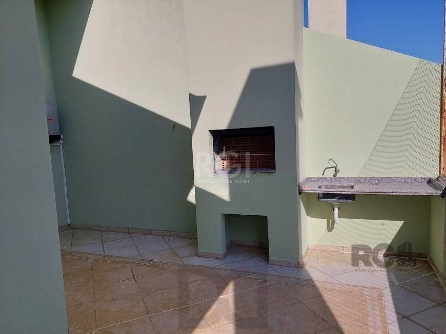 Casa com 03 dormitórios, 01 suíte, pátio, terraço com churrasqueira e vaga de garagem para 03 carros no bairro Ipanema — foto 15