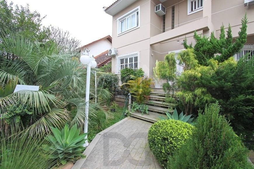 EXCELENTE CASA COM 4 DORMITÓRIOS, 6 VAGAS DE GARAGEM E VISTA PANORÂMICA. — foto 2