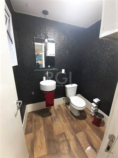 Casa com 233m², 2 dormitórios sendo 1 suíte, living com lareira, espaço gourmet com churrasqueira, pátio e 2 vagas de garagem no bairro Sarandi — foto 8