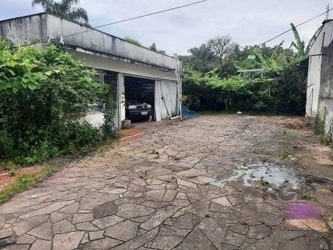 OPORTUNIDADE DE NEGÓCIO! PONTO COMERCIAL OU RESIDENCIAL, terreno medindo 13m x 100m, com 02 lojas comercias em frente (atualmente alugadas), nos fundos possui sobrado com 03 dormitórios sendo 01 suí — foto 9
