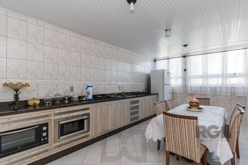 Casa Mista 266m² - 4 dormitórios, 1 suíte, 3 vagas no bairro Parque Santa Fé — foto 13