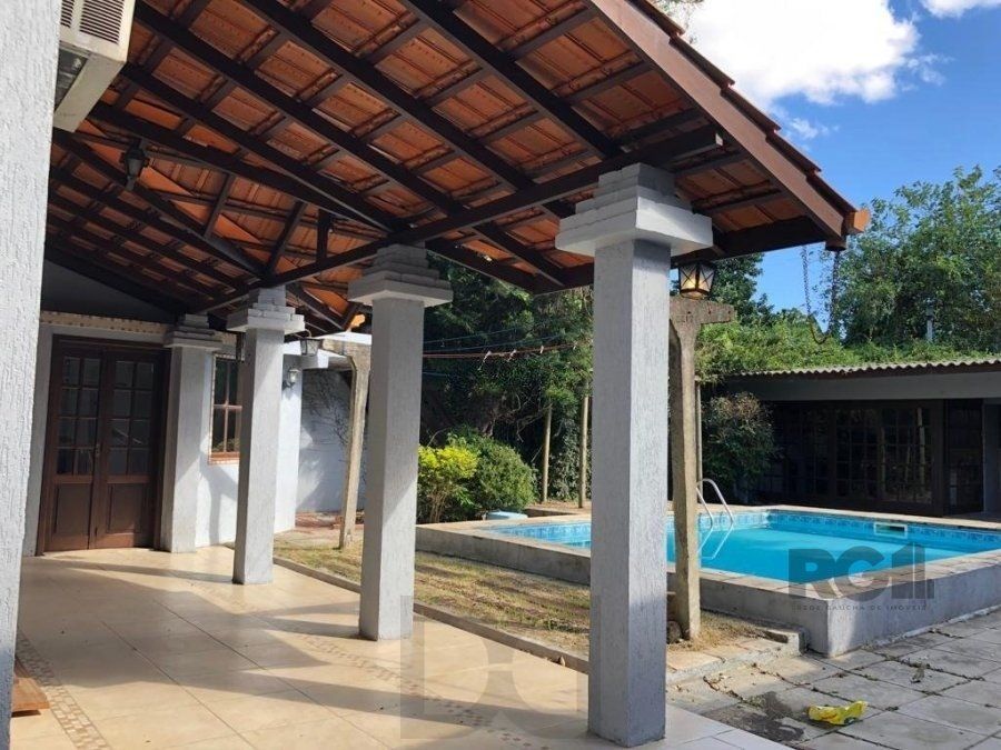 Casa de 365m² - 4 dormitórios sendo 3 suítes e 5 vagas de garagem no bairro Partenon — foto 2