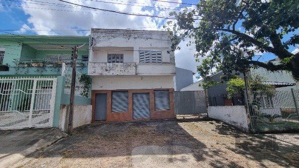 Casa /Sobrado com apartamento e loja, estacionamento, a venda no Bairro Jardim Itu. Lojão embaixo com dois banheiros e divisórias, — foto 1