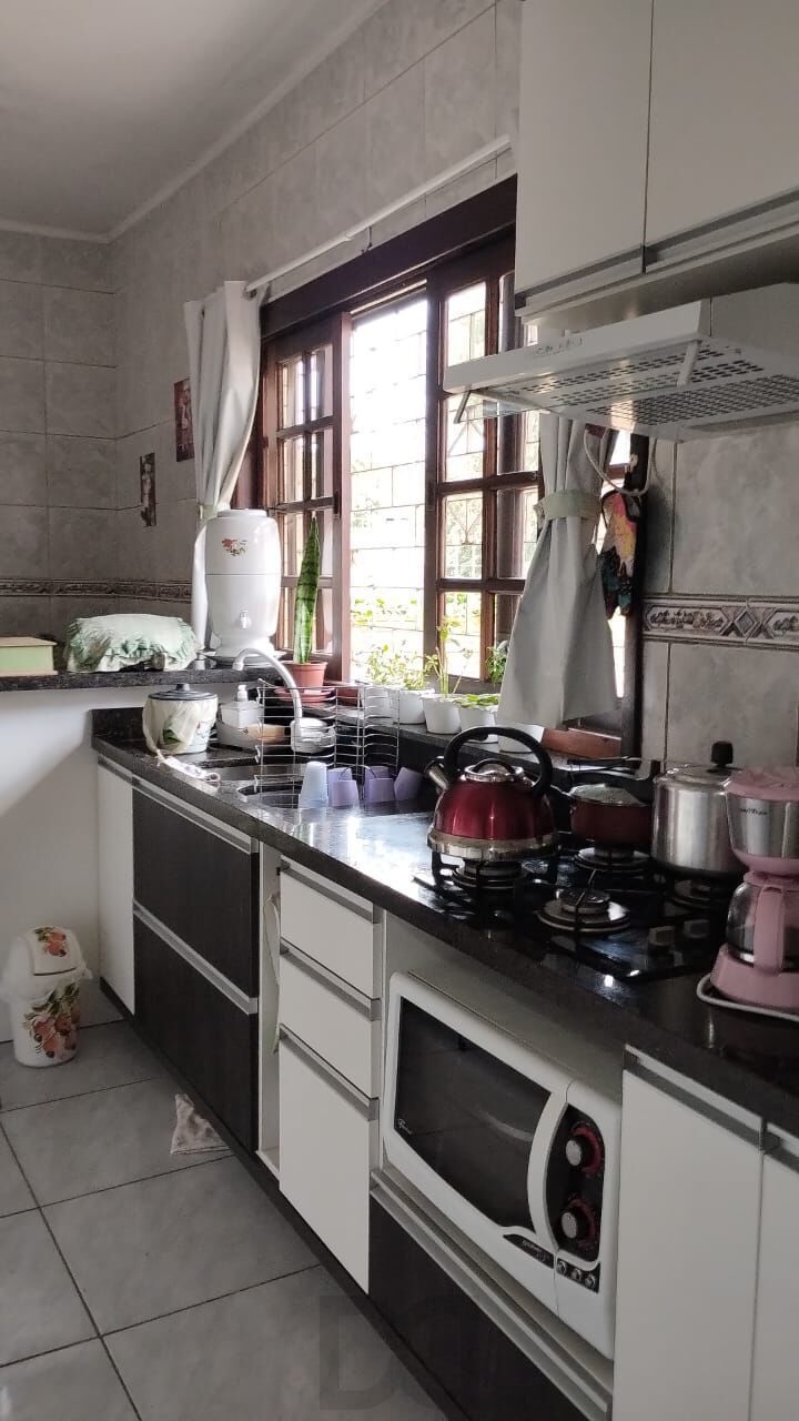 Terreno com duas frentes, três casas (duas c/dois dormitórios e a outra tipo tipo JK) — foto 15