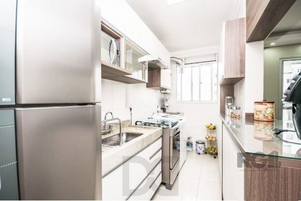 Apartamento com 2 quartos, sala, cozinha, sacada com churrasqueira e 1 vaga. — foto 6