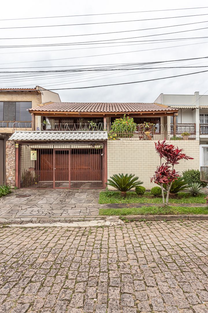 Excelente casa de dois pavimentos no bairro Ipanema, com 238m² de área privativa, 4 dormitórios, 1 suíte e 2 vagas de garagem. — foto 49