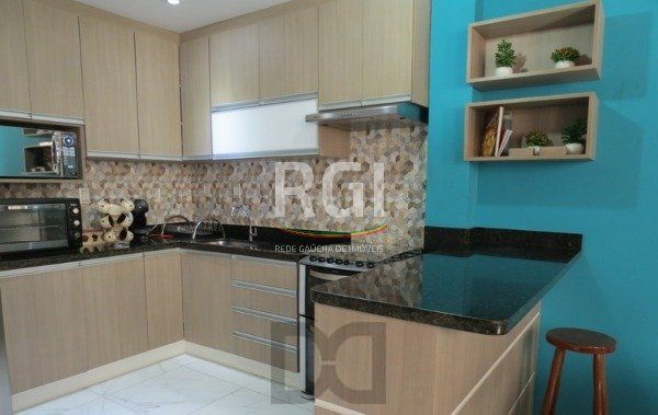 Excelente Residência em condomínio no Bairro Santo Antônio, com 3 dormitórios. — foto 16