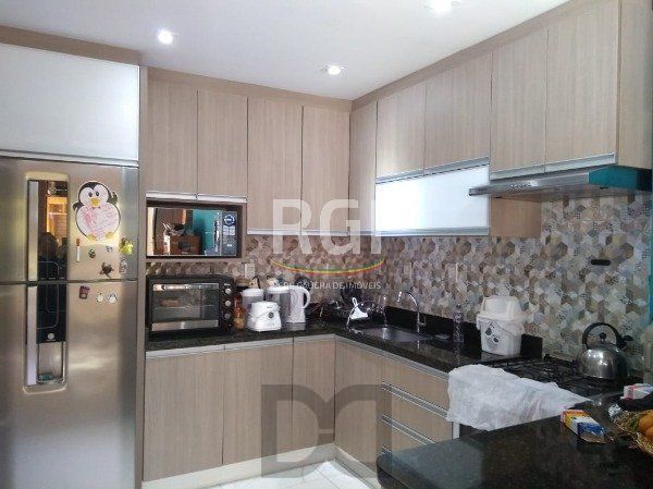 Excelente Residência em condomínio no Bairro Santo Antônio, com 3 dormitórios. — foto 13