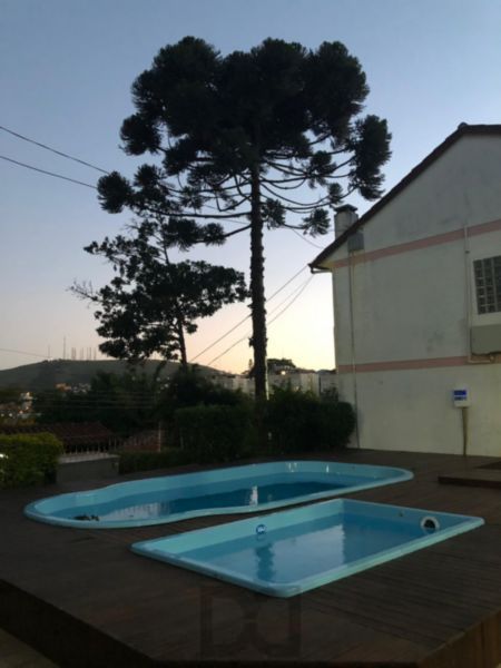 Excelente Residência em condomínio no Bairro Santo Antônio, com 3 dormitórios. — foto 1