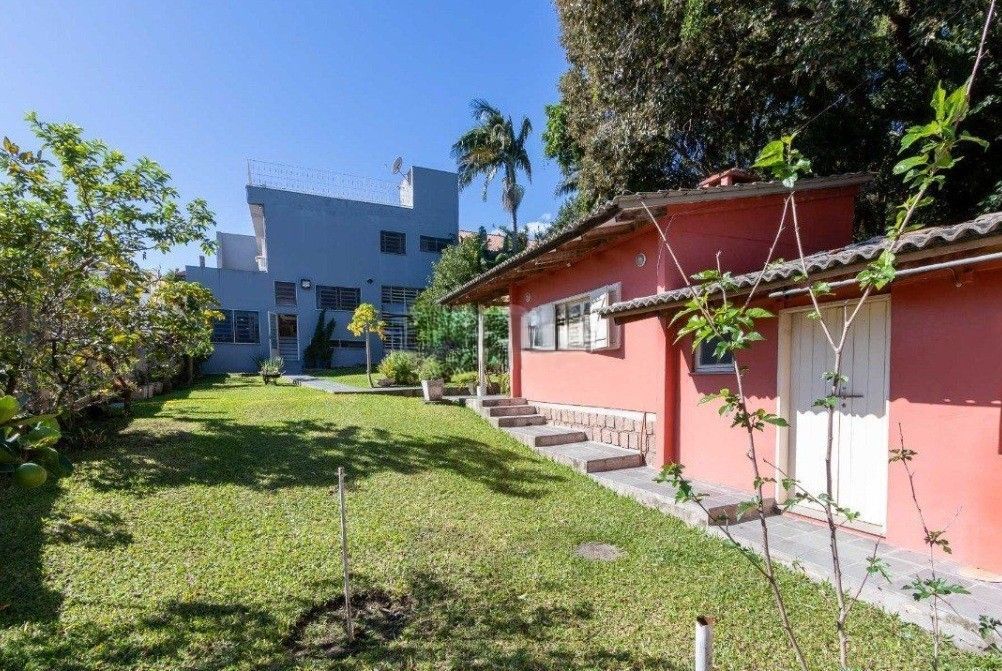 Excelente casa com 5 dormitórios, 2 suítes, 3 vagas de garagem e uma vista perene para o por do sol no Guaiba. — foto 53
