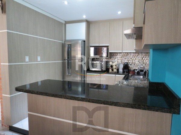 Excelente Residência em condomínio no Bairro Santo Antônio, com 3 dormitórios. — foto 14