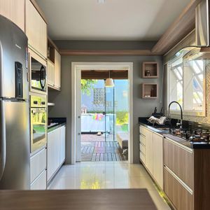 Casa com 184m², 3 dormitórios, 1 suíte, 2 vagas no bairro Igra Norte em Torres para Comprar