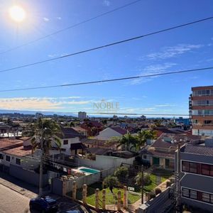 Apartamento com 83m², 2 dormitórios, 1 suíte, 2 vagas no Bellagio Residenziale em Torres para Comprar