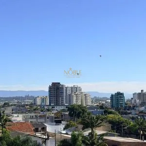Apartamento com 64m², 2 dormitórios, 1 suíte, 1 vaga no Aston em Torres para Comprar