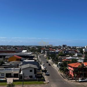 Apartamento com 60m², 2 dormitórios, 1 suíte, 1 vaga no Residencial Morada do Sol em Torres para Comprar