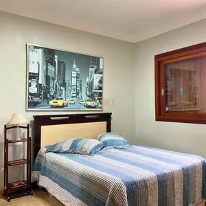 Casa com 272m², 4 dormitórios, 1 suíte, 3 vagas no bairro Igra Norte em Torres para Comprar