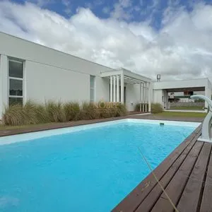 Casa de Condomínio com 174m², 3 dormitórios, 3 suítes, 2 vagas no Reserva das Águas em Torres para Comprar
