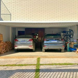 Sobrado com 350m², 4 dormitórios, 4 suítes, 2 vagas no bairro Centenário em Torres para Comprar
