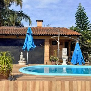 Casa com 240m², 4 dormitórios, 1 suíte, 3 vagas no bairro Praia da Cal em Torres para Comprar