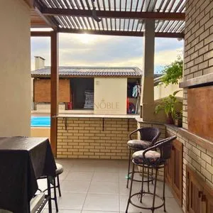 Casa com 272m², 4 dormitórios, 1 suíte, 3 vagas no bairro Igra Norte em Torres para Comprar