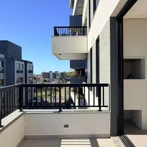 Apartamento com 64m², 2 dormitórios, 1 suíte, 1 vaga no Aston em Torres para Comprar