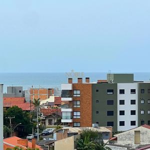 Apartamento com 64m², 2 dormitórios, 1 suíte, 1 vaga no Aston em Torres para Comprar