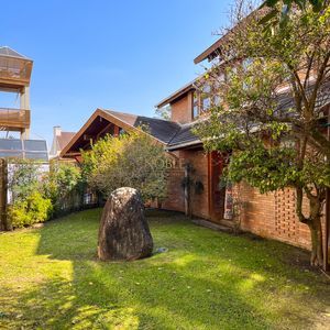 Casa, 4 dormitórios, 2 suítes, 3 vagas no bairro Praia Grande em Torres para Comprar