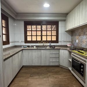 Casa, 3 dormitórios, 1 suíte, 2 vagas no bairro Igra Sul em Torres para Comprar