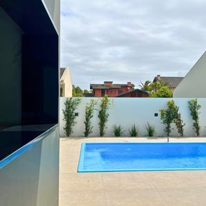 Casa com 288m², 4 dormitórios, 4 suítes, 4 vagas no bairro Bella Torres em Passo de Torres para Comprar