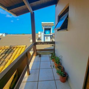 Sobrado com 330m², 3 dormitórios, 1 suíte, 5 vagas no bairro Centenário em Torres para Comprar