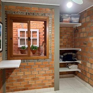 Casa com 98m², 3 dormitórios, 2 vagas no bairro Praia da Cal em Torres para Comprar