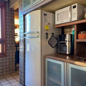 Apartamento com 102m², 2 dormitórios, 1 suíte, 1 vaga no La Tour em Torres para Comprar