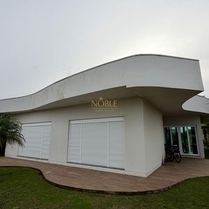 Casa de Condomínio com 293m², 3 dormitórios, 3 suítes, 2 vagas no Ocean Side em Torres para Comprar