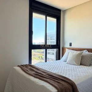 Apartamento com 64m², 2 dormitórios, 1 suíte, 1 vaga no Aston em Torres para Comprar